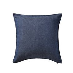 a blue denim pillow on a white background