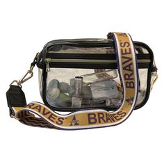 Show your Braves love with our new deluxe, zippered clear stadium bag and custom adjustable crossbody strap. It is part of our I Am Grambling collection by LEX Gear.   This elegant clear purse is the perfect fashion forward accessory for game day, concerts, festivals, weddings, graduations, work...every day. It is made from high quality soft 3 mm pvc and is much more durable than other bags made of thin materials in the marketplace. The size of the bag is  10 x 6 x 3.25 inches and is perfect to accommodate you mobile phone, credit cards, keys, cash, lipstick, sunglasses, etc. The custom crossbody strap has the Alcorn logo and Braves on the front and purple and gold stripes on the back.  Unlike most straps in the marketplace, our straps have re-enforced endings. It is tough, and comfortable Clear Stadium Bag, Stadium Bag, Clear Purses, Gold Stripes, The Bag, Atlanta Ga, Crossbody Strap, Credit Cards, Game Day