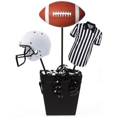 a football, helmet, and jersey are on display in a black box with a white striped shirt