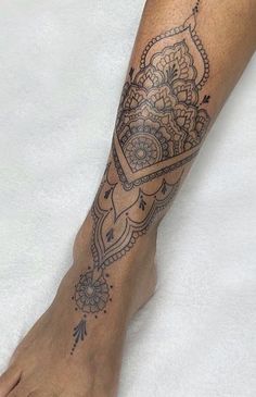 a close up of a person's foot with a tattoo on it