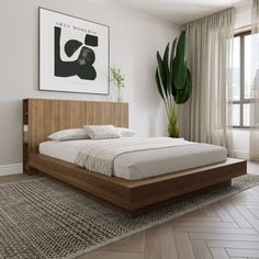 a bedroom with a bed, plant and large window in it's center area