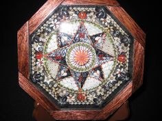 a wooden clock with an intricate design on it