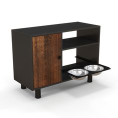 an entertainment center with two bowls on the front and one bowl on the back side