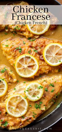 chicken francee with lemons and parsley on the side in a skillet