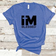 "The \"I'm Blessed\" T-shirt is a simple yet powerful garment that serves as a reminder and declaration of gratitude and appreciation. It features the phrase \"I'm Blessed\" prominently, conveying a sense of thankfulness for the abundance of blessings in one's life. This T-shirt celebrates the positive aspects of life and encourages an attitude of gratitude, reminding wearers to recognize and cherish the blessings they have been bestowed with. It serves as a positive and uplifting expression of faith, contentment, and a reminder to count one's blessings daily. This classic unisex jersey short sleeve tee fits like a well-loved favorite. Soft cotton and quality print make users fall in love with it over and over again.  .: 100% Airlume combed and ringspun cotton (fiber content may vary for d Im Blessed, An Attitude Of Gratitude, Positive Aspects, Cross Shirt, Cross Shirts, Attitude Of Gratitude, One Life, Jersey Shorts, Light Fabric