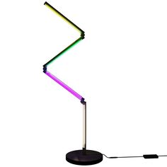 a multicolored desk lamp on a white background