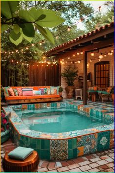 an outdoor swimming pool with seating and lights