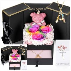 there is a pink teddy bear in a box with flowers and other items around it