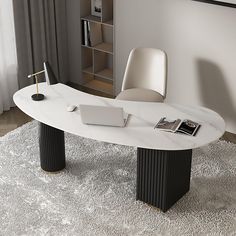 a white table with black legs and a laptop on it