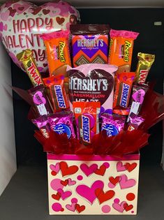 a valentine's day gift box filled with chocolates and candy