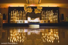 the stage is decorated with flowers and candles