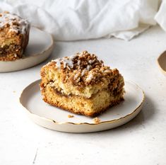 two slices of coffee cake on white plates