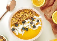 a bowl filled with cereal and fruit next to two bowls of oatmeal