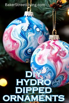 two ornaments hanging from a christmas tree with the words diy hydro dipped ornaments on them