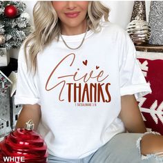 "Introducing our Comfort Colors Lovely Give Thanks Thanksgiving Unisex T-Shirt 4 - the perfect addition to your Thanksgiving festivities! This Thanksgiving Tee features a striking graphic design, boasting a heartfelt message of gratitude. Made from high-quality materials, this Graphic Thanksgiving Shirt guarantees ultimate comfort and durability. Whether you're celebrating with friends or enjoying a cozy family gathering, this Fun Family Shirt is versatile for anyone. Spread the holiday cheer with this trendy yet timeless Thanksgiving Tee. Order yours today and give thanks in style! ❤Comfort Colors brand t-shirt ❤Style number Comfort Colors 1717 ❤Unisex Adult Sizing. Relaxed Fit ❤100% ring spun cotton, garment-dyed ❤7/8\" double-needle top-stitched collar ❤Twill taped neck and shoulders fo Give Thanks Shirt, Thanksgiving Shirt Ideas, Thanksgiving Vinyl, Thanksgiving Festivities, Celebrating With Friends, Give Thanks To The Lord, Cute Fall Shirt, Thankful Shirt, Thanksgiving Tee