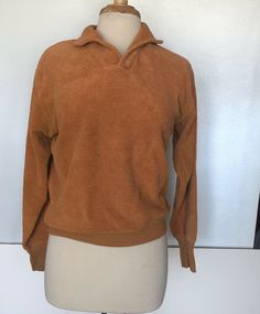 KNITRON Terry Cloth Pullover Sweater Tan Medium Vintage 60s/70s. Good vintage condition for age. Repair done on inside front neck (see photos; not noticeable when worn); see photos for measurements; msg with questions Retro Collared Polo Sweater For Fall, Retro Long Sleeve Tops With Ribbed Collar, Retro Long Sleeve Top With Ribbed Collar, Vintage Collared Sweater For Winter, Retro Collared Sweater For Winter, Retro Collared Winter Sweater, Vintage Brown Knit Top, Retro Long Sleeve Sweater With Ribbed Collar, Vintage Collared Tops For Winter