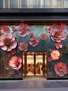 the front entrance to gucci's store with pink flowers painted on it