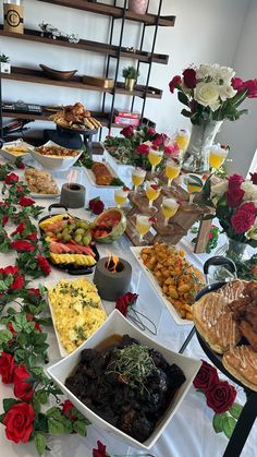 a long table filled with lots of food and drinks on it's sidelines