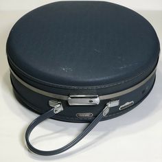 Really nice, vintage round hard suitcase. American Tourister Tiara case. Overall, this is in great shape, but there are some imperfections and wear: Initials written on edge; No key is included. Small stains/discoloration on interior straps. Small hole in makeup pouch. Minor cosmetic wear on outer surfaces. Please see photos for more details, and let me know if you have any questions. Round Suitcase, Salvaged Decor, Blue Suitcase, Vintage Train Case, Hard Suitcase, Daniel Fast, Retro Stuff, Vintage Suitcase, American Tourister