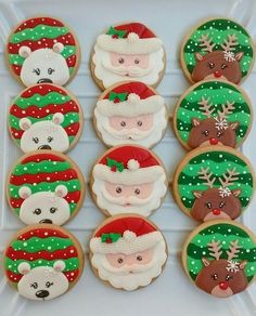 decorated cookies with santa claus and reindeer faces on them are arranged in the shape of snowflakes