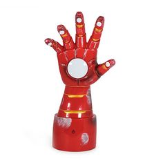 an iron man hand statue is shown on a white background