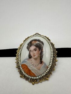 Vintage Genuine  hand painted french porcelain Necklace Choker  Vintage bronze filligree  About 2.5 inch long Velvet ribbon around the neck Choker Pendant and pin  Can be worn on a chain  All jewelry is shipped in a nice gift box.   Check out our over a THOUSAND great reviews Bronze Cameo Necklace For Vintage Collection, Vintage Yellow Gold Cameo Necklace, Ornate Antique Gold Cameo Necklace, Gold Cameo Necklace Collectible, Ornate Cameo Necklace For Collectors, Porcelain Necklace, French Porcelain, Neck Choker, Choker Pendant