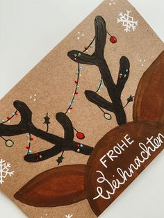 a christmas card with the words frome celebration written in white ink on brown paper