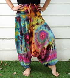 "💥One Size Fits Most Comfortable Low Cut Drop Crotch Tie Dye Harem Pants, Hippie Pants, Tie Dye Baggy Pants, Festival Harem Pants, Festival Clothing, Tye Dye Genie Pants, Tie Dye Comfy Pants 👉Fabric: Soft and Breathable Rayon 👉Smocked Elasticated Waist: 26\" up to 54\" 👉Hips up to: 60\" 👉Total Length: 39\" (Top to Bottom) 👉 Around elastic ankle 10\" 👉 Tie Dye Method 👉 One Size Fits M-XL or US 2-20 👉Extremely Comfortable 👉Boho/Hippie Theme, Beach Wear/Festival Going Pants Note: Due to t Hippie Baggy Bottoms For Summer, Bohemian Tie Dye Cotton Pants, Summer Hippie Baggy Pants, Baggy Multicolor Harem Pants For Summer, Hippie Relaxed Fit Harem Pants For Summer, Summer Multicolor Baggy Harem Pants, Summer Hippie Relaxed Fit Harem Pants, Relaxed Fit Harem Pants For Summer Festivals, Tie Dye Hippie Harem Pants For Festivals