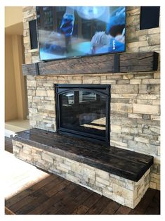 a fireplace with a flat screen tv mounted on it's wall above the mantle