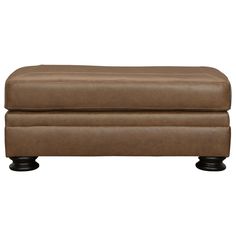 a brown leather ottoman with black legs