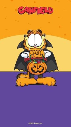 garfield the cat sitting on top of a pumpkin