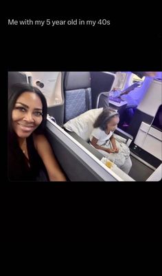 two women are sitting in an airplane and one is taking a selfie