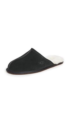 PRICES MAY VARY. Full-grain leather upper 17mm sheepskin insole Foam footbed Suede outsole Recycled polyester binding Ugg Black Slippers, Mens Uggs Slippers, Mens Ugg Fur Slippers, Mens Black Velvet Slippers, Black Suede Slip-on Slippers, Mens Uggs, Material Exterior, Kids Luggage, Luxury Store