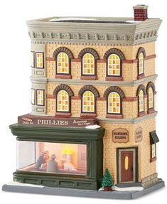 there is a small model of a building with people in the front and side windows