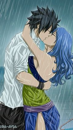 a couple kissing in the rain under an umbrella