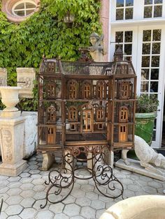 a bird cage sitting on top of a table