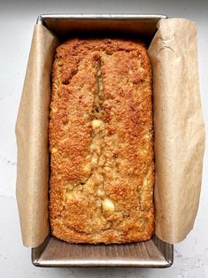 a loaf of bread sitting in a metal pan