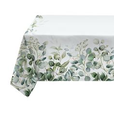 a white table cloth with green leaves on it