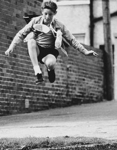 a young man is jumping in the air