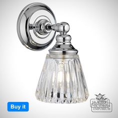 a chrome wall light with crystal glass shades on the front and back of it's arm