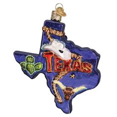 a glass ornament with the shape of texas painted on it's side