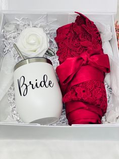 the bride gift box includes a white mug and red garter