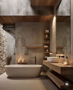 a bathroom with two sinks and a bathtub in the middle, surrounded by stone walls