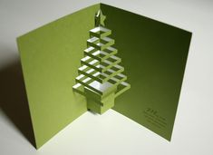 a folded card with a christmas tree on it