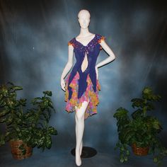 will fit size 5/6-11/12, very stretchy Be bold and express yourself in this Latin-rhythm dress that converts to a ballroom dress, crafted from luxurious deep periwinkle purple slinky stretch fabric featuring vibrant floral print accents. The eye-catching details don't stop there: embellishments of silk flowers & Swarovski rhinestones add a touch of sparkle, while the wrap-style long skirt brings movement and drama with yards of petal-like chiffon panels. A great buy, as to have a similar custom Fitted Purple Dance Dress, Fitted Purple Dress For Dance, Deep Periwinkle, Periwinkle Purple, Latin Dress, Ballroom Dress, Floral Chiffon, Tropical Print, Ballroom