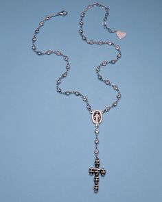 Elevate your style with our Skull Cross Rosary. Made with a skull cross pendant, this rosary adds a unique touch to any outfit. Crafted for the confident individual, this piece will surely make a statement. Perfect for those seeking a bold and edgy look. 18k gold-plated, cubic zirconia 14" Necklace| 2" extension chain| 1.5" Cross Handmade in Los Angeles with imported materials Follow these tips to keep your jewelry looking its best! Goth Rosary, Cross Necklace Grunge, Silver Gothic Cross Necklace, Grunge Cross Necklace, Cross Necklace Goth, Goth Rosary Necklace, Edgy Look, Future Tattoos, Rosary