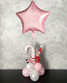 an inflatable balloon with a pink star on top and the words'amelia me back'above it