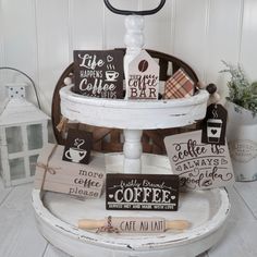 there is a cake stand that has coffee signs on it