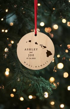 a wooden ornament hanging from a christmas tree