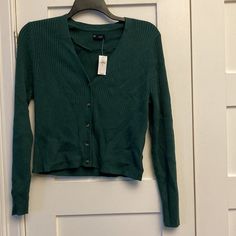 Nwt Gap Skinny Rib V-Neck Cardigan In What They Call "June Bug Green." Smoke-Free Home. Pit To Pit Approximately 20". Shoulder To Hem Approximately 21". Gap V-neck Tops For Fall, Gap Sweater For Spring Layering, Gap V-neck Fall Sweater, Gap Fall Top With Button Closure, Gap Button Closure Top For Fall, Fall Button Closure Top By Gap, Casual Gap V-neck Sweater, Green V-neck Sweater With Button Closure, Casual V-neck Sweater By Gap